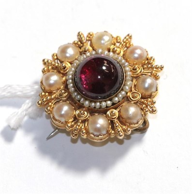 Lot 362 - A garnet and cultured pearl brooch/pendant, 2.6cm diameter