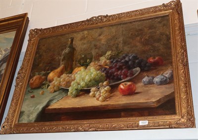 Lot 1037 - Joseph de Belder (1871-1927) Still life of fruit, signed, oil on board, 50cm by 80cm