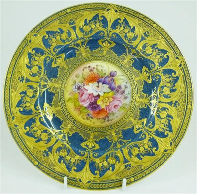 Lot 30 - A Royal Worcester Porcelain Cabinet Plate, 1931, painted by Ernest Phillips with a spray of flowers