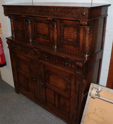 Lot 1144 - An reproduction oak court cupboard in the 17th century style
