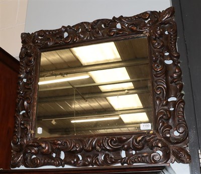 Lot 1150 - A Rococo style gesso mirror