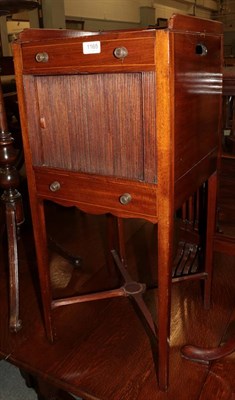 Lot 1165 - A late George III mahogany tambour front bedside cupboard, galleried top, two drawers, square...