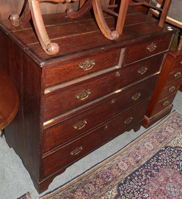 Lot 1174 - A George III oak and mahogany cross banded five-drawer chest