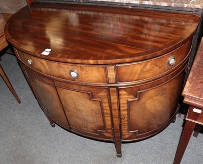 Lot 1195 - A reproduction mahogany demi-lune side cabinet