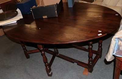 Lot 1197 - A reproduction oak wake table