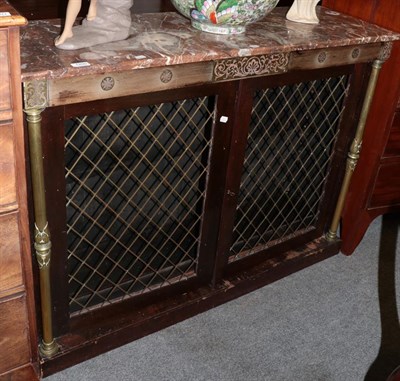 Lot 1200 - A Regency mahogany and brass inlaid two door cabinet, the rouge marble top above an inlaid...