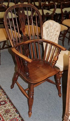 Lot 1214 - A 19th century ash spindle back armchair