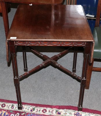 Lot 1220 - A George III style mahogany cluster leg drop leaf table