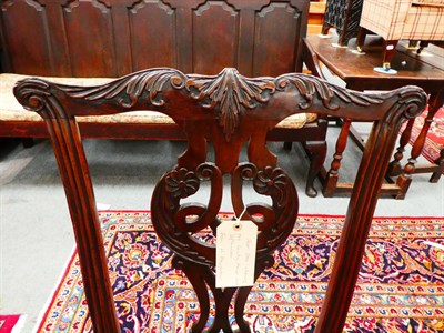 Lot 1222 - A pair of George III mahogany dining chairs with cream close-nailed leather seats