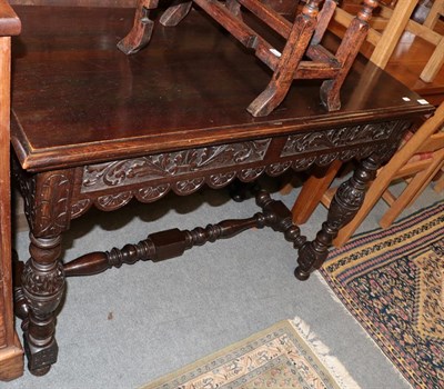 Lot 1237 - A Victorian carved oak hall table