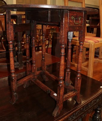Lot 1238 - An early 18th century small drop-leaf table with single drawer and a oak oval top table (adapted)