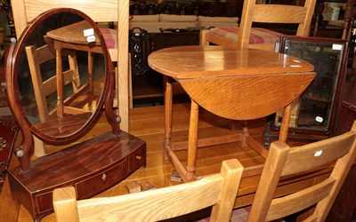 Lot 1240 - A small oak drop-leaf table and two George III toilet mirrors