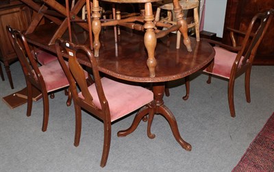 Lot 1248 - A walnut dining table together with a set of six chairs (7)