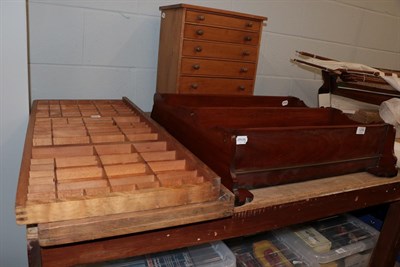 Lot 1258 - A small pine chest, a wall rack and two printing trays