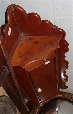 Lot 1262 - A Victorian pine hanging corner cupboard and a mahogany butler's tray with stand