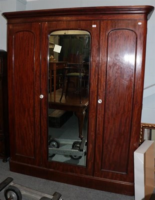 Lot 1263 - A Victorian mahogany triple door wardrobe, late 19th century, the moulded cornice above three...