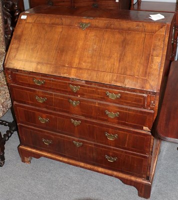 Lot 1269 - A mid-18th century walnut bureau with fitted interior and four drawers