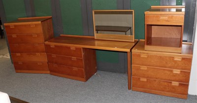 Lot 1292 - A cherry bedroom suite from Heal's comprising a five-drawer chest, a three-drawer chest a...