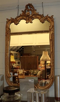 Lot 1294 - A Rococo style gilt wall mirror