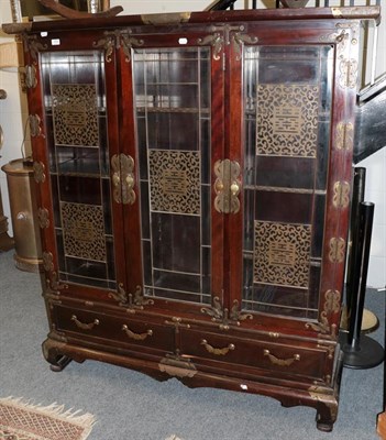 Lot 1305 - A Chinese glazed display cabinet applied with brass bat motifs
