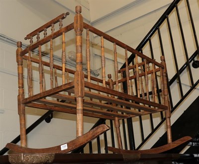 Lot 1306 - A late 19th/early 20th century spindle turned crib