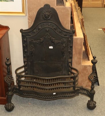 Lot 1319 - A large black painted serpentine shaped fire grate and fire back