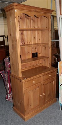 Lot 1322 - A pine bookcase cabinet together with pine and tile-top kitchen table