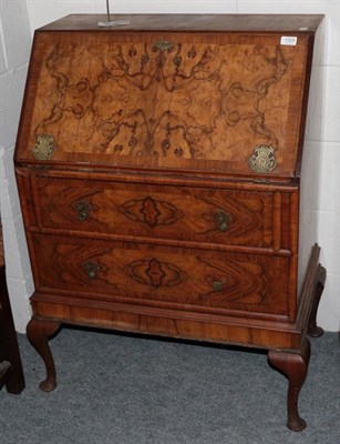 Lot 1328 - A walnut bureau