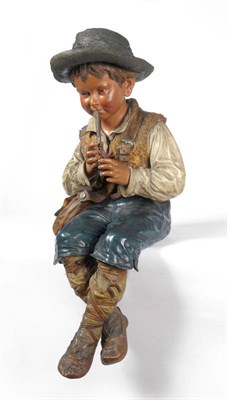 Lot 52 - A Bretby Large Polychrome Pottery Figure of an Alpine Flautist, circa 1885, as a young boy...