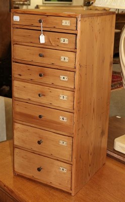 Lot 1337 - A Victorian pine eight drawer graduated chest