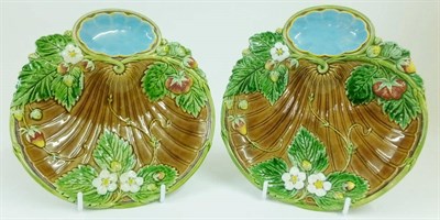 Lot 53 - A Pair of Minton Majolica Strawberry Dishes, 1867, of shaped oval form, moulded with blossoming and
