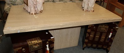 Lot 1343 - A modern travertine pedestal dining table