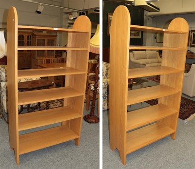 Lot 1351 - A pair of modern Shaker bookcases, circa 2000, each with two shaped uprights and six fixed shelves