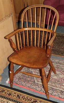 Lot 1353 - A 19th century ash spindle back armchair