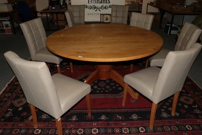 Lot 1367 - A reproduction oak circular dining table, from Clarity Arts, 154cm wide (top sections can be...