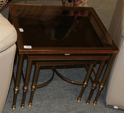 Lot 1368 - Brass and smoked glass nesting tables