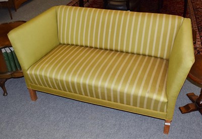 Lot 1284 - An early 20th Century oak framed sofa