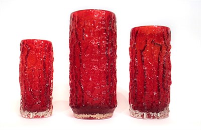 Lot 18 - Whitefriars - Geoffrey Baxter: A Trio of Textured Range Cylindrical Bark Glass Vases, in ruby,...