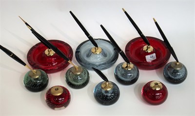 Lot 44 - Whitefriars - Seven Parker Pen Holder Glass Bubble Paperweights, in ruby, arctic blue and ocean...