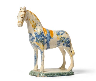 Lot 81 - An English Pottery Model of a Horse, late 18th/early 19th century, standing four square on a...