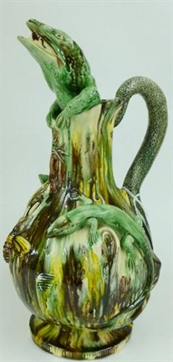 Lot 114 - A Caldas Palissy Style Pottery Jug, late 19th/early 20th century, of baluster form, the spout...
