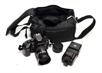 Lot 3211 - Nikon F4 Camera no.2407789 with Nikkor AF f3.5-4.5 35-105mm lens and a few other items in soft case