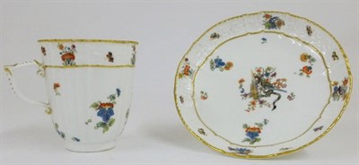 Lot 130 - A Meissen "Kakiemon" Coffee Cup and Saucer, circa 1760, of fluted form with basket moulded borders