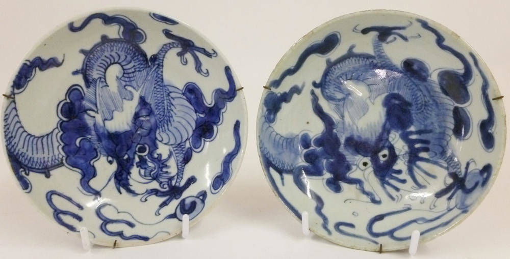 Lot 174 - A Pair of Chinese Porcelain Saucer Dishes, 18th century, painted in underglaze blue with...