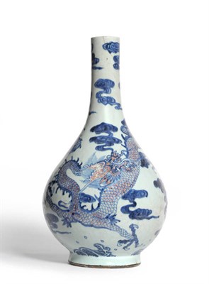 Lot 182 - A Chinese Underglaze Blue and Copper Red Decorated Porcelain Bottle Vase, Qing Dynasty,...