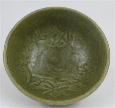 Lot 183 - A Chinese Celadon Glazed Porcelain Bowl, Ming Dynasty (1368-1644), with rounded sides,...