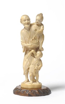 Lot 202 - A Japanese One Piece Carved Elephant Ivory Figure Group, late Meiji period (1868-1912), of a...
