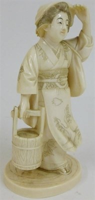 Lot 204 - A Japanese One Piece Carved Elephant Ivory Okimono, circa 1910, as a young woman wearing...