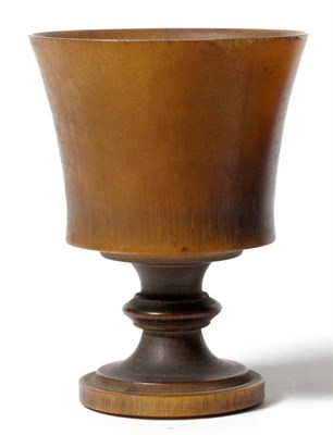 Lot 207 - A Rhinoceros Horn Turned Pedestal Cup, circa 1920, of cylindrical form, 10cm high, 113g approx...