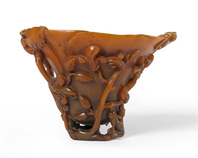 Lot 211 - A Chinese Carved Rhinoceros Horn Magnolia Libation Cup, late 17th/early 18th century, carved in...